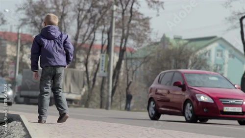 Wallpaper Mural boy near the road/boy standing in the roadside and leave the car on the road Torontodigital.ca