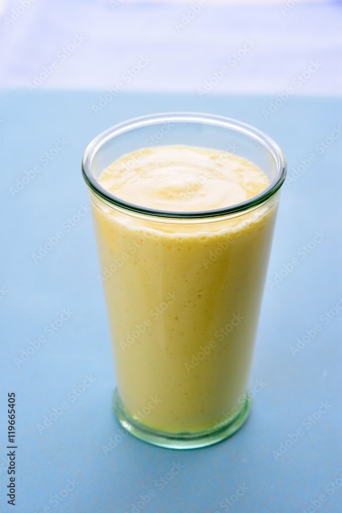Mango lassi smoothie yellow drink. Mango lassi smoothie yellow drink.