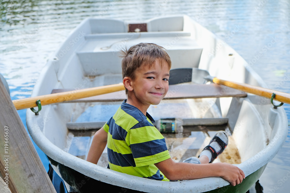portrait of a boy in a boat