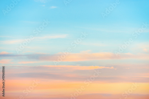 Pale sunset sky with pink  orange and red colors