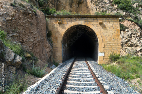 Old train tunnel with railway