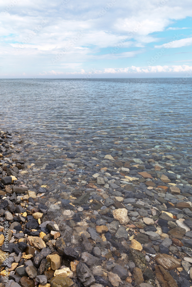 Baikal in summer. Unique water clarity. Water in the lake is so clear that individual stones can be seen at a depth of 40 meters