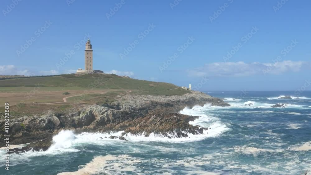 A Coruna, Spain with the Tower of Hercules in the background. The tower is the oldest Roman lighthouse in use today and overlooks the Atlantic Ocean coast. A Coruna, Spain with the Tower of Hercules in the background. The tower is the oldest Roman lighthouse in use today and overlooks the Atlantic Ocean coast.