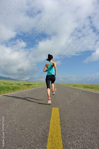 healthy lifestyle young fitness woman runner running on road