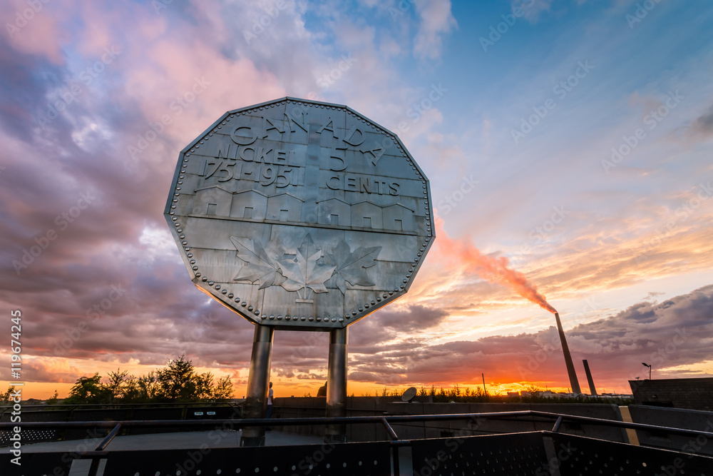 Fototapeta premium Big Nickel landmark in Sudbury, Ontario, Canada during sunset