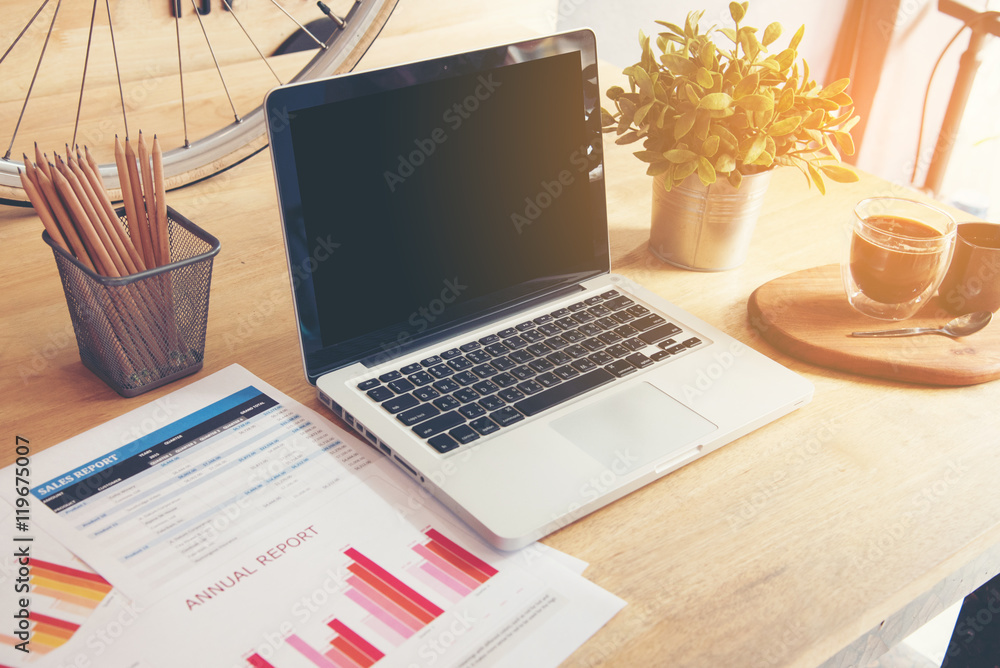 Fototapeta premium Working in office with Showing Hand Market Report Charts.Marketing Department Planning New Strategy.Researching Process Wood Table.Horizontal.Blurred Background.Film effect.