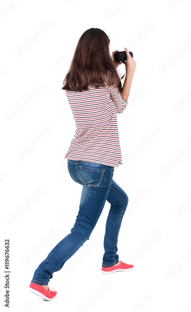 Back view of woman photographing. girl photographer in jeans. Rear view people collection. backside view of person. Isolated over white background. Back view of woman photographing. girl photographer in jeans. Rear view people collection. backside view of person. Isolated over white background.