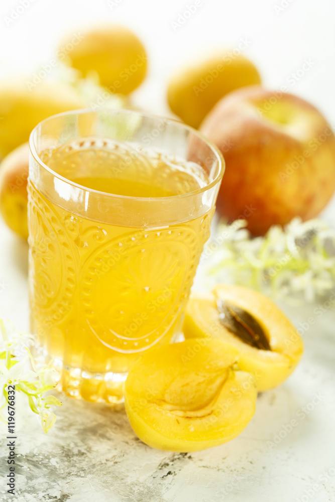Fototapeta premium Glass of peach and apricot drink