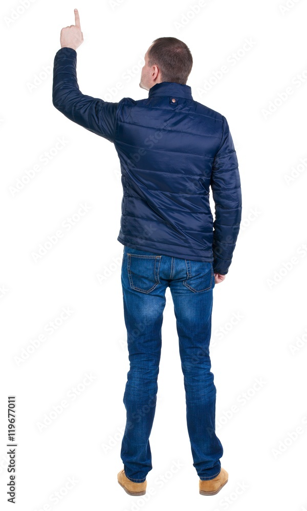 Back view of pointing young men in jacket and jeans. Young guy gesture. Rear view people collection. backside view of person. Isolated over white background.
Back view of pointing young men in jacket and jeans. Young guy gesture. Rear view people collection. backside view of person. Isolated over white background.