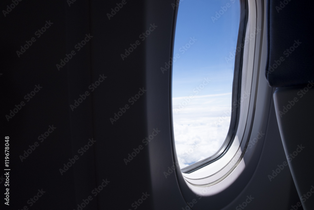 Airplane red seat and window inside an aircraft Airplane red seat and window inside an aircraft