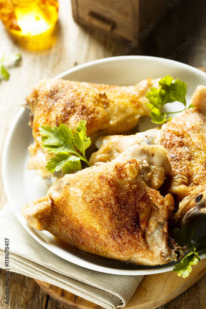 Fried chicken with spices and fresh parsley Fried chicken with spices and fresh parsley