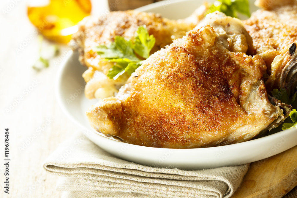 Fried chicken with spices and fresh parsley Fried chicken with spices and fresh parsley