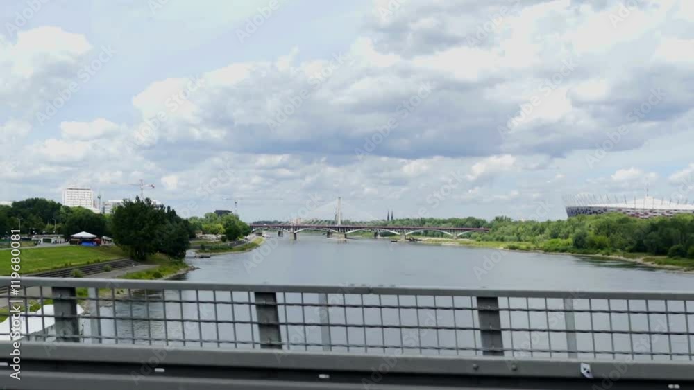 POLAND 2016: A car is driving on a bridge over Visla from one side of the city to another. We can see water underneath. Wide-angle shot.
POLAND 2016: A car is driving on a bridge over Visla from one side of the city to another. We can see water underneath. Wide-angle shot.