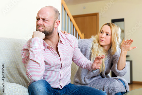 Woman comforting man photo