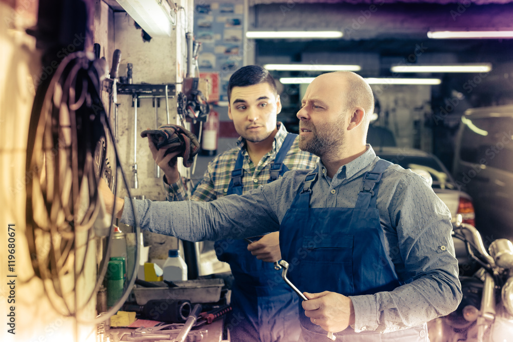men  working at carshop