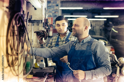 men  working at carshop