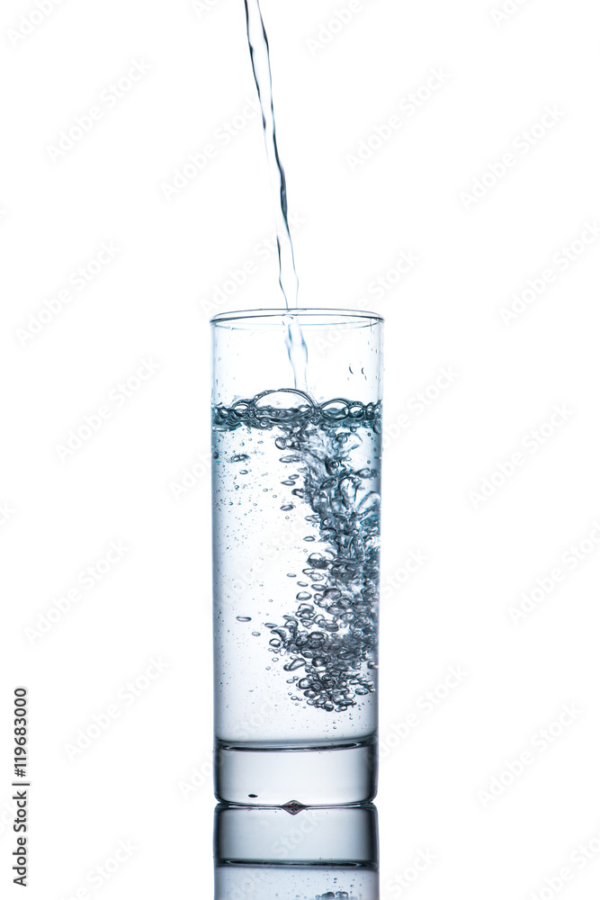 Drinking water is poured into a glass Drinking water is poured into a glass