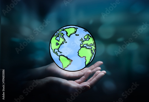 Fototapeta Naklejka Na Ścianę i Meble -  Businesswoman holding hand drawn planet earth