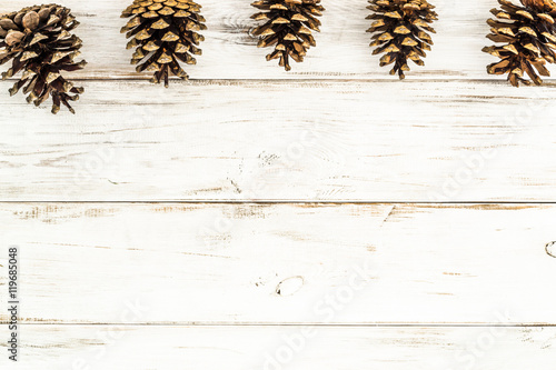 Pine cones on wood