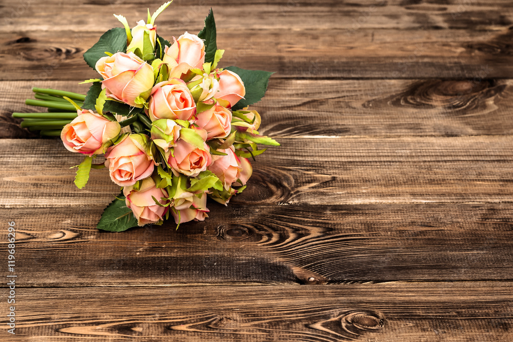 Pink roses on wooden background Pink roses on wooden background