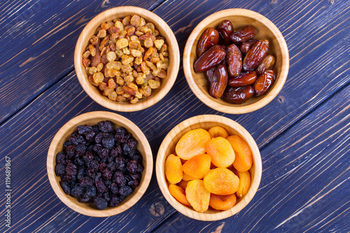 Dried fruits assortment on wooden background. Top view