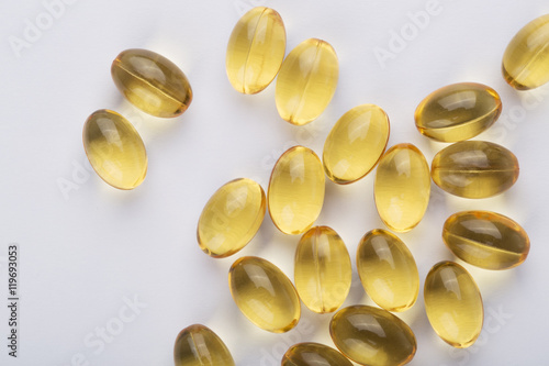 Fish oil capsules on the white