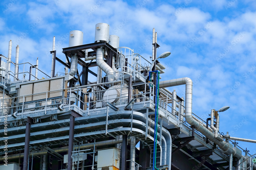 Top floor of boiler or HRSG of combine cycle power plant against blue sky Top floor of boiler or HRSG of combine cycle power plant against blue sky