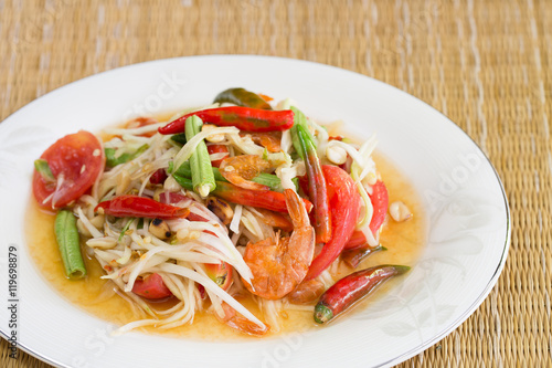 Green papaya salad with dried salted prawn in white dish on brow