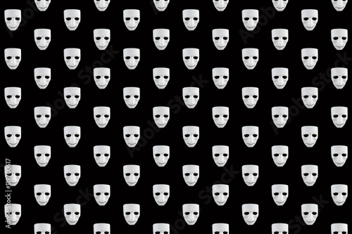 White masks on a black background.