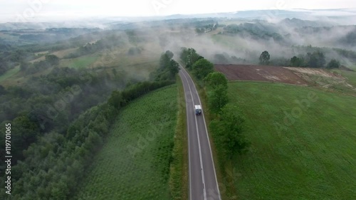 Aerial View Of Car On Foggy Rural Road