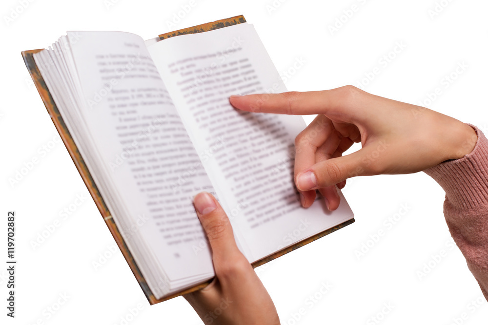 Obraz premium Isolated Female Hands holding a Vintage Book, pointing on a Word