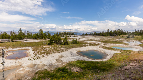 Fototapeta Naklejka Na Ścianę i Meble -  Thumb Paint Pots were originally known as Mud Puffs. Water here is much more acidic and dissolves the rock into clay. West Thumb Geyser Basin, Yellowstone National Park, Wyoming