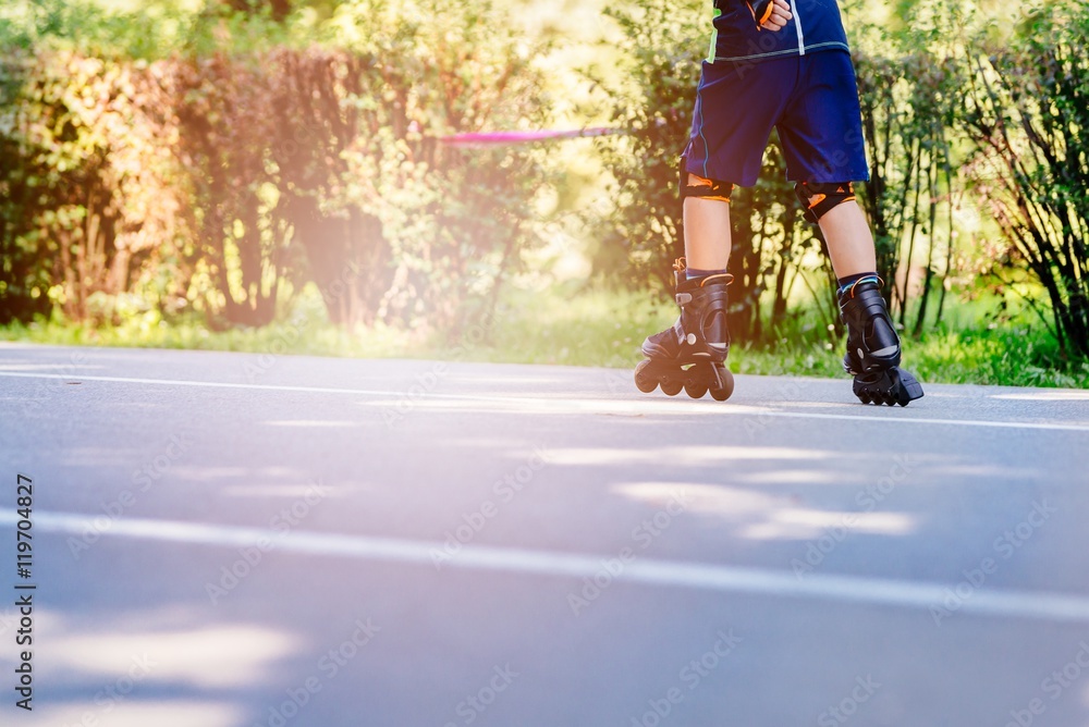Happy child rollerblading on a sunny day Happy child rollerblading on a sunny day