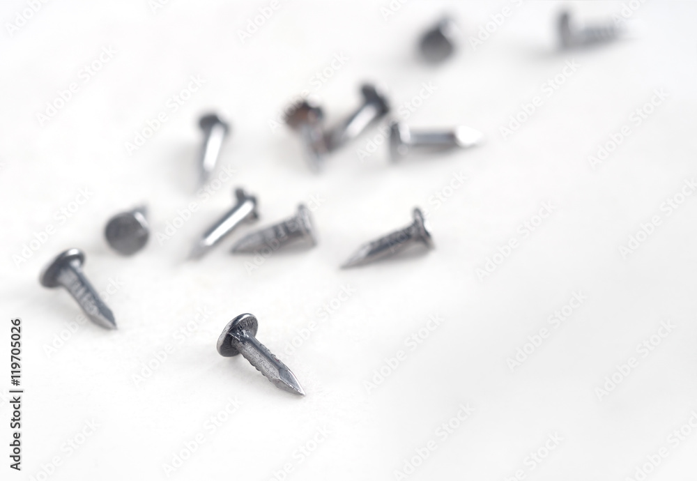 Tack / View of small tack on white paper background. Tack / View of small tack on white paper background.
