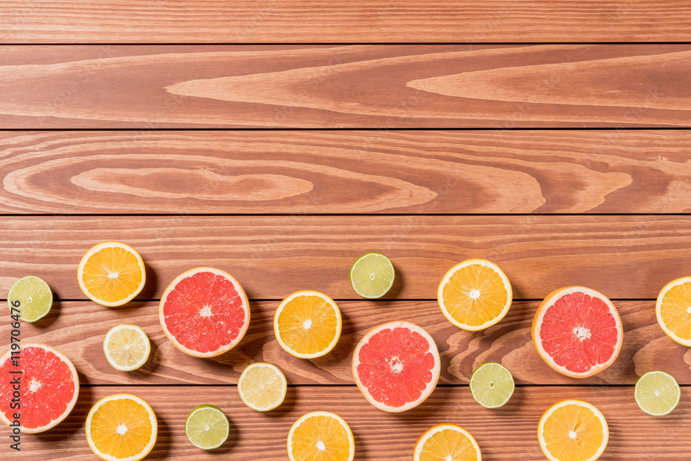 Sliced fruits on brown wooden table Sliced fruits on brown wooden table