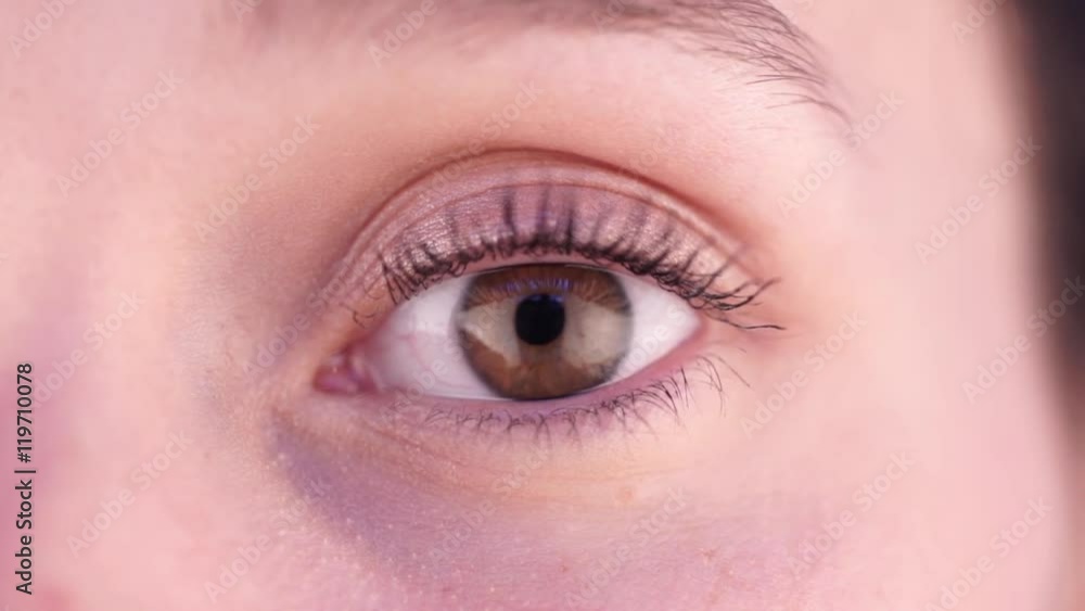 View of a Detailed close up of an brown eye in high definition View of a Detailed close up of an brown eye in high definition