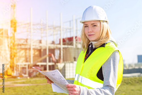 Portrait of an attractive woman worker on a construction site