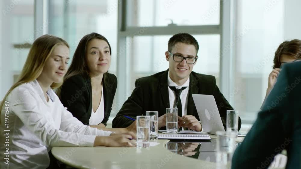 loughing at business meeting