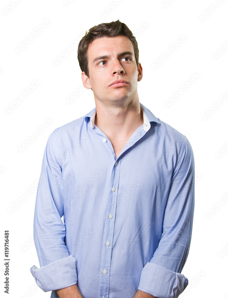 Serious young man looking up on white background Serious young man looking up on white background