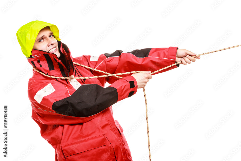 Fototapeta premium Young man pulling rope.