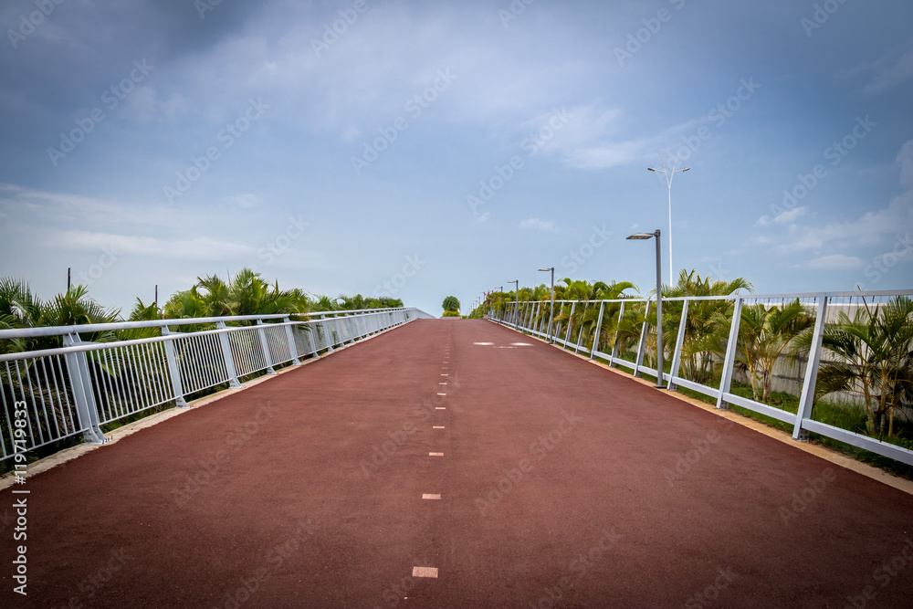Bicycle lane and a jogging path surrounded by green in Cinta Costera - Panama City, Panama Bicycle lane and a jogging path surrounded by green in Cinta Costera - Panama City, Panama