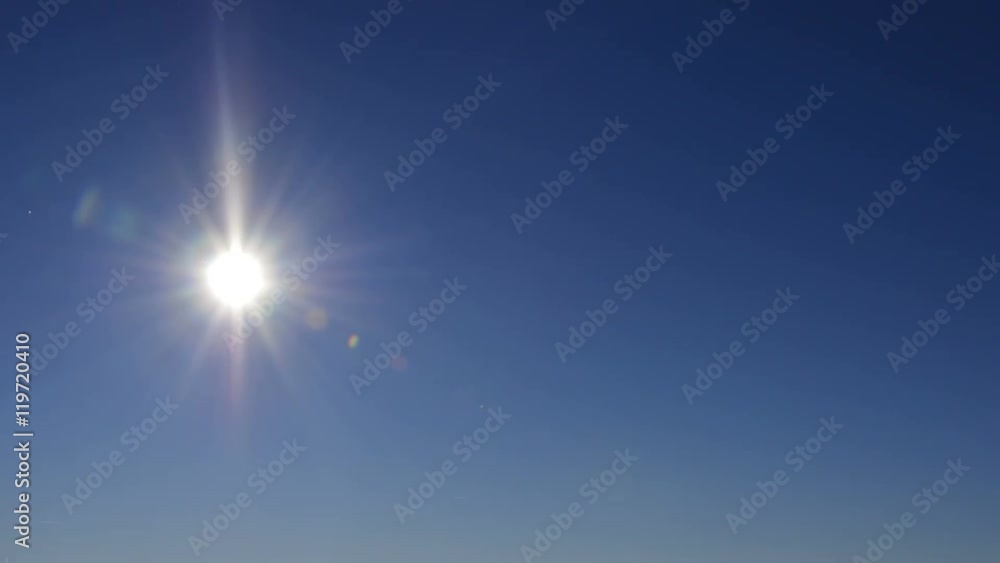 Sun moving across the clear blue sky,  timelapse background