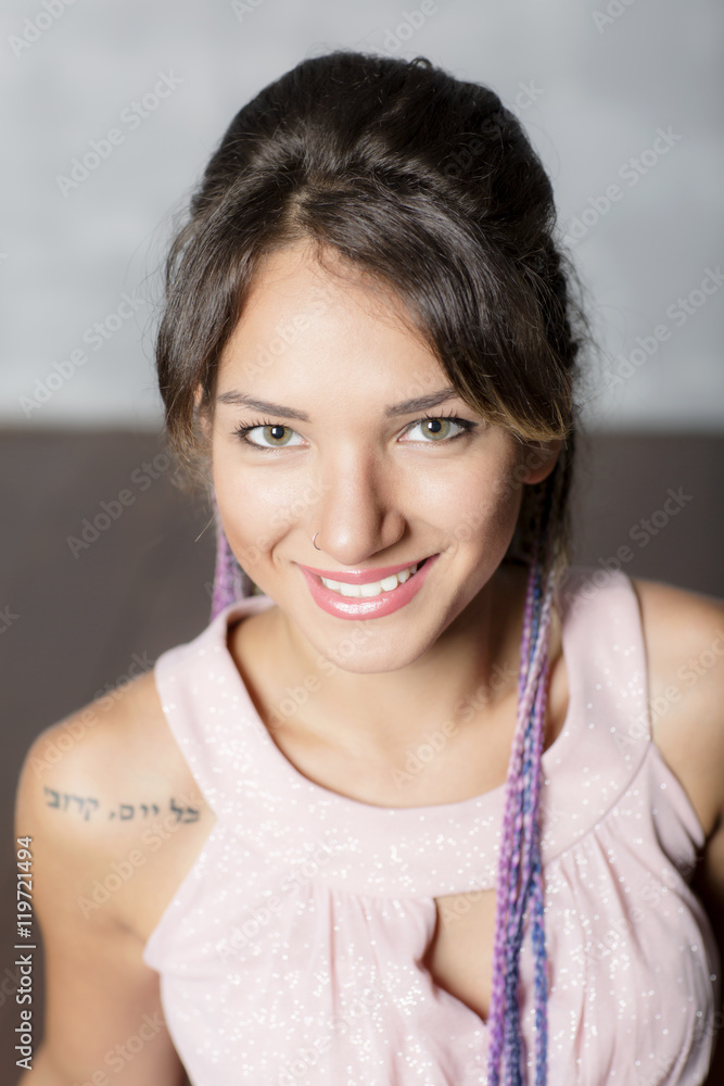 Portrait of a woman in an evening dress close-up. Beautiful girl with hair woven into braids and makeup. Portrait of a woman in an evening dress close-up. Beautiful girl with hair woven into braids and makeup.