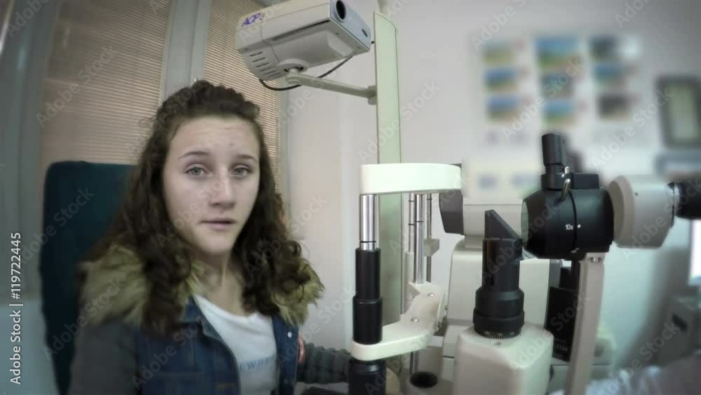 Young girl having her eyes examined by an eye doctor