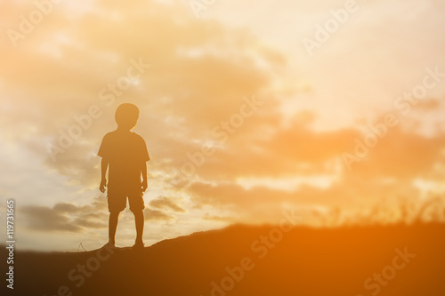 silhouette of a happy children and happy time sunset