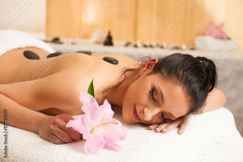 Beautifulyoung woman having a rejuvenating massage in a wellness