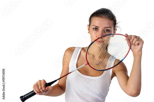Pretty fit woman holding badminton racket at white background