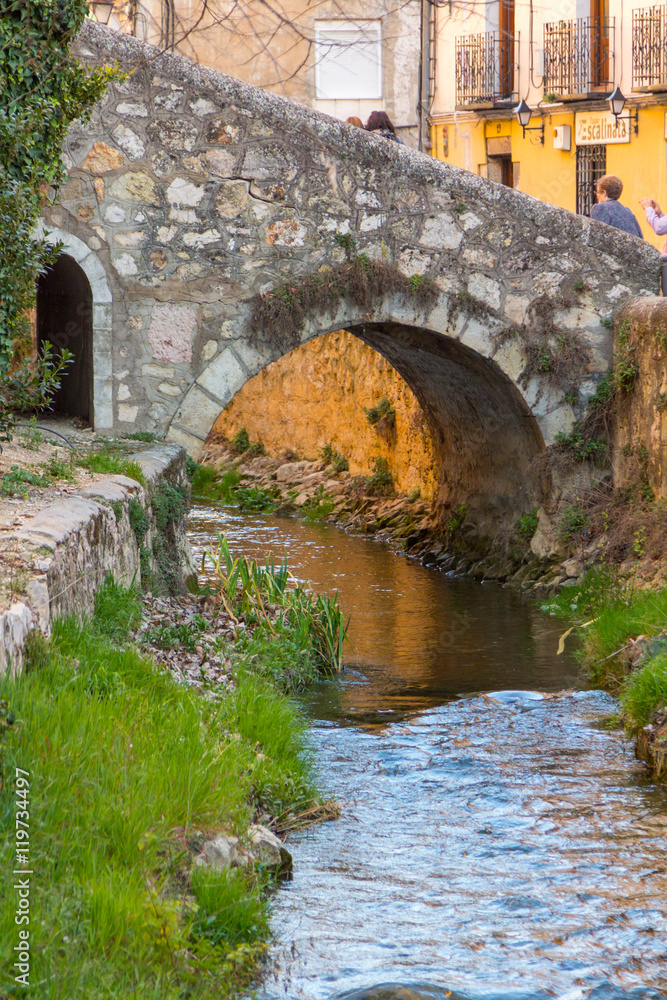 Arch stone bridge and pedestrian in the city of Cuenca, Spain