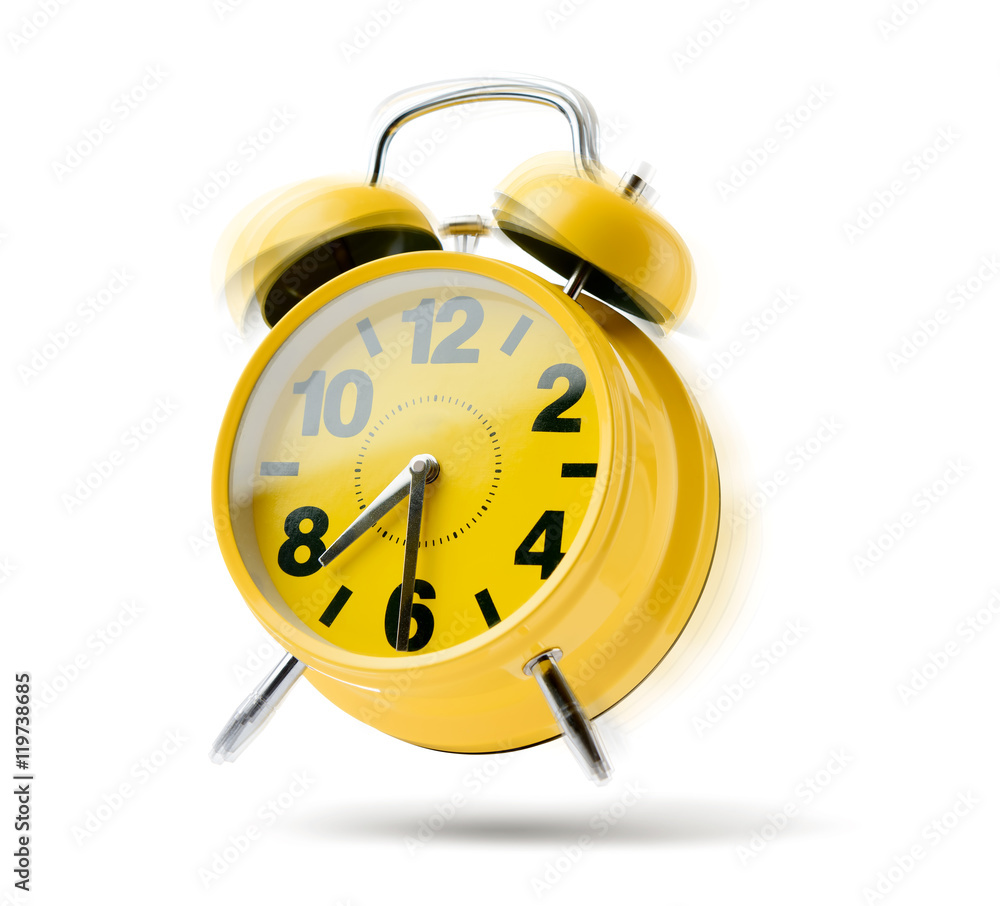 Yellow alarm clock rings in the morning isolated on white background