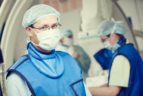 male andiography surgeon at surgery operating room photo